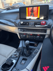 BMW 5-Serie GT F07 09-17 - 12,3" radio met Apple CarPlay en Android Auto gemonteerd in een auto-interieur.