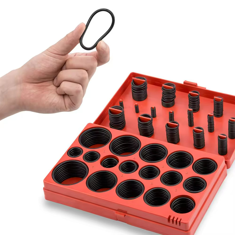 Hånd holder en O-ring fra O-ring sæt 419 dele i en rød plastboks med organiserede størrelser.